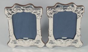 A PAIR OF SILVER FRAMED UPRIGHT PHOTOGRAPH FRAMES 7.5ins x 6ins.