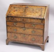 AN 18TH CENTURY FIGURED WALNUT BUREAU with fall front and fitted interior over two short and two