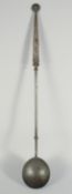 AN EARLY DUTCH METAL LADLE. 32ins long.