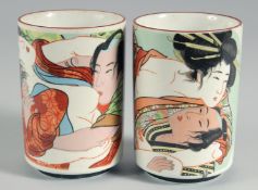 A PAIR OF JAPANESE SEMI-EROTIC BRUSH HOLDERS. 4.5ins high.