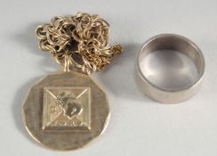 A SILVER BRACELET, PENDANT AND RING.