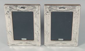A PAIR OF SILVER FRAMED UPRIGHT PHOTOGRAPH FRAMES 7.25ins x 5.5ins.