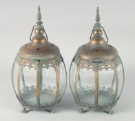 A PAIR OF ISLAMIC PATTERN OCTAGONAL LANTERNS 18ins high.