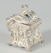A SILVER PLATED ROCOCO TEA CADDY. 5ins high.