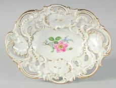 A RUSSIAN PORCELAIN OVAL PIERCED DISH, white ground edged in gilt with flowers. Cross swords mark in