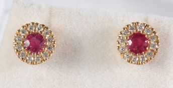 A PAIR OF 18CT GOLD, RUBY AND DIAMOND CLUSTER EAR STUDS.