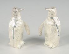 A SMALL PAIR OF SILVER PLATED PENGUIN SALT AND PEPPERS. 2.5ins high.