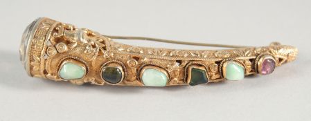 A SILVER GILT CLAW BROOCH set with semi-precious stones.