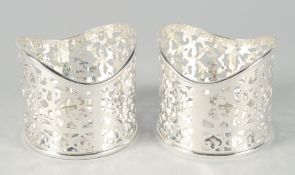A PAIR OF CIRCULAR PIERCED PLATED COASTERS. 4.5ins diameter.