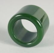 A JADE ARCHER'S RING.