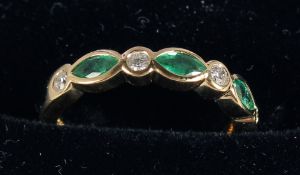 AN 18CT GOLD, EMERALD AND DIAMOND HALF HOOP RING.