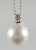 AN UNUSUAL 18CT GOLD PENDANT AND CHAIN set with a large grey freshwater pearl and diamonds.