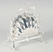 A VICTORIAN STYLE ENGRAVED PLATED FOLDING SHELL CHEESE AND BISCUIT STAND with rustic stand.