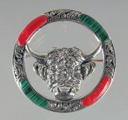 A SILVER AND MALACHITE BULL BROOCH.