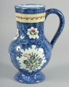 A DELFT SPECKLED BLUE JUG painted with panels of flowers.