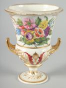 A DERBY TWO HANDLED URN SHAPED VASE painted with panels of flowers. 8.5ins high.