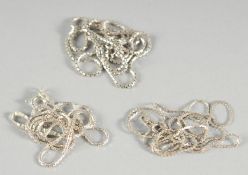 THREE SILVER NECK CHAINS.