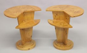 A PAIR OF ART DECO STYLE CIRCULAR TABLES with cut off segment on curving supports and circular
