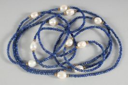 A LAPIS LAZULI AND FRESHWATER PEARL ROPE NECKLACE.