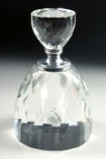 A CUT GLASS CIRCULAR SCENT BOTTLE AND STOPPER. 5.5ins high.