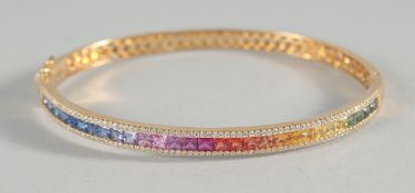 AN 18CT GOLD, MULTI COLOURED NATURAL SAPPHIRE AND DIAMOND BANGLE.