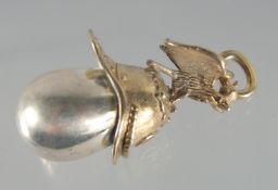 A RUSSIAN SILVER EGG AND HELMET PENDANT. 1.75ins