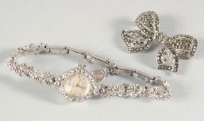 AN ACCURIST MARCASITE WATCH AND BROOCH.