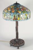 A GOOD LARGE TIFFANY STYLE BRONZE TABLE LAMP with leaded stain glass shade.