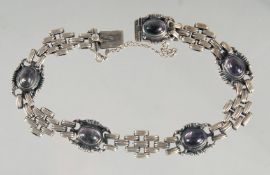 A SILVER AND AMETHYST BRACELET.