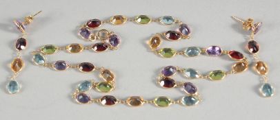 AN 18CT GOLD MULTI-COLOURED GEMSTONE NECKLACE with a pair of matching EARRINGS.