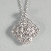 AN 18CT GOLD AND DIAMOND PENDANT AND CHAIN.