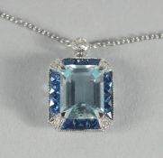 AN 18CT GOLD, AQUAMARINE, SAPPHIRE AND DIAMOND PENDANT.