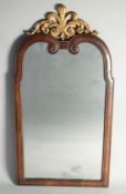 A GOOD 18TH CENTURY WALNUT UPRIGHT MIRROR with cushion frame and carved gilded Prince of Wales