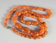 AN AMBER FORTY FIVE BEAD NECKLACE.