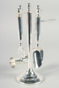 A SILVER PLATED BAR TOOL SET on a stand. 11ins high.