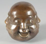 A BRONZE FOUR FACE BUDDHA. 4.5ins high.