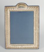 A LARGE SILVER UPRIGHT PHOTOGRAPH FRAME. 9.5ins x 7ins.