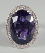 A GOOD LARGE 18CT GOLD, AMETHYST AND DIAMOND CLUSTER RING amethyst approx. 19ct, diamonds approx.