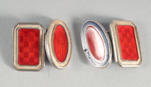 A PAIR OF SILVER AND RED ENAMEL CUFF LINKS.