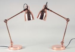 A PAIR OF COPPER ANGLEPOISE LAMPS.