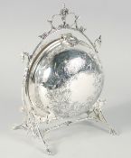 A VICTORIAN STYLE ENGRAVED PLATED FOLDING CIRCULAR CHEESE AND BISCUIT STAND with rustic stand.