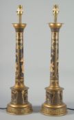 A PAIR OF TOLEWARE CHINESE DECORATED LAMPS 24ins high.