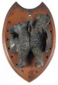 A 19TH CENTURY BLACK FOREST CARVED WOOD PLAQUE, two game birds.