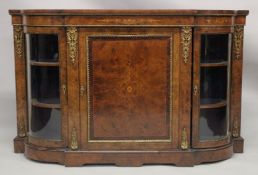 A GOOD VICTORIAN EDWARDS & ROBERTS WALNUT CREDENZA with central panel door flanked by glass bow