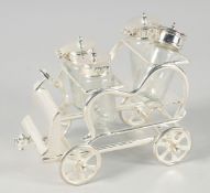 A SILVER PLATED FOUR CAR CRUET. 6ins.