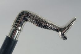 A NOVELTY LEG WALKING STICK.