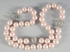 A CHANEL LARGE 43 PEARL NECKLACE with brilliant set double C clasp.