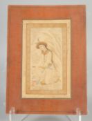 A LATE SAFAVID / EARLY QAJAR MINIATURE PAINTING ON PAPER, depicting a kneeling figure with gilt