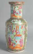 A CHINESE CANTON FAMILLE ROSE PORCELAIN VASE, painted with panels of figures, birds and butterflies,