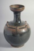 A CHINESE TANG STYLE BLACK GLAZE VASE, 18cm high.